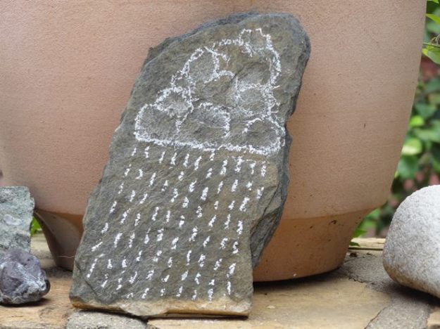 20cm high flat stone, sepcially collected for this purpose from the Namib. I made the drawing with white Chalk drawing. 