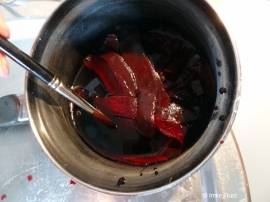 Boiled beetroot peels create a lovely red colour, which I painted onto the frozen ice/egg