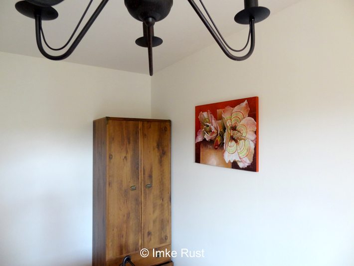 View of the room with altered artwork