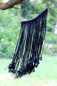 69 Strands of (be)Longing, Fake and natural hair, branch and wire. May 2016